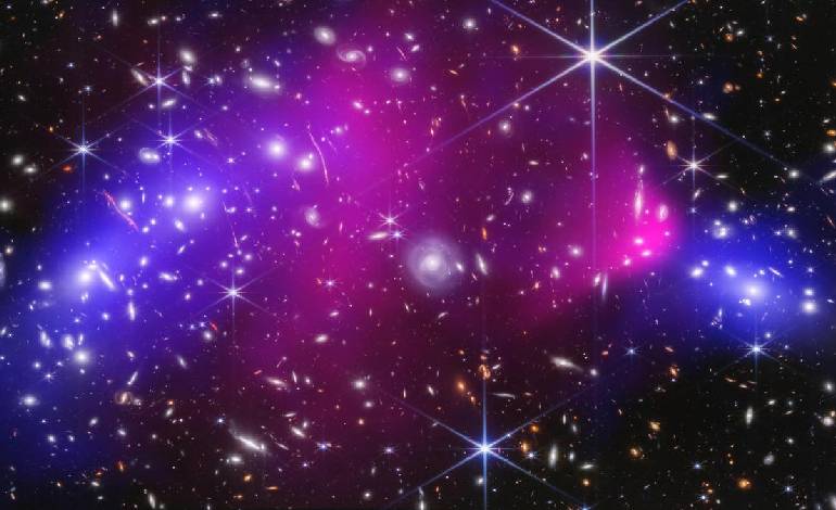 ‘Little red dot’ mystery may be young black holes buried in gas, study finds